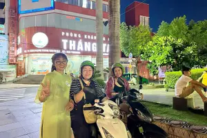 Tour image of Saigon Night Sights & Local Food by Motorbike| Opt: Ao Dai Riders