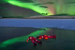 Tour image of Ice Floating in Forest Lake with Aurora Borealis
